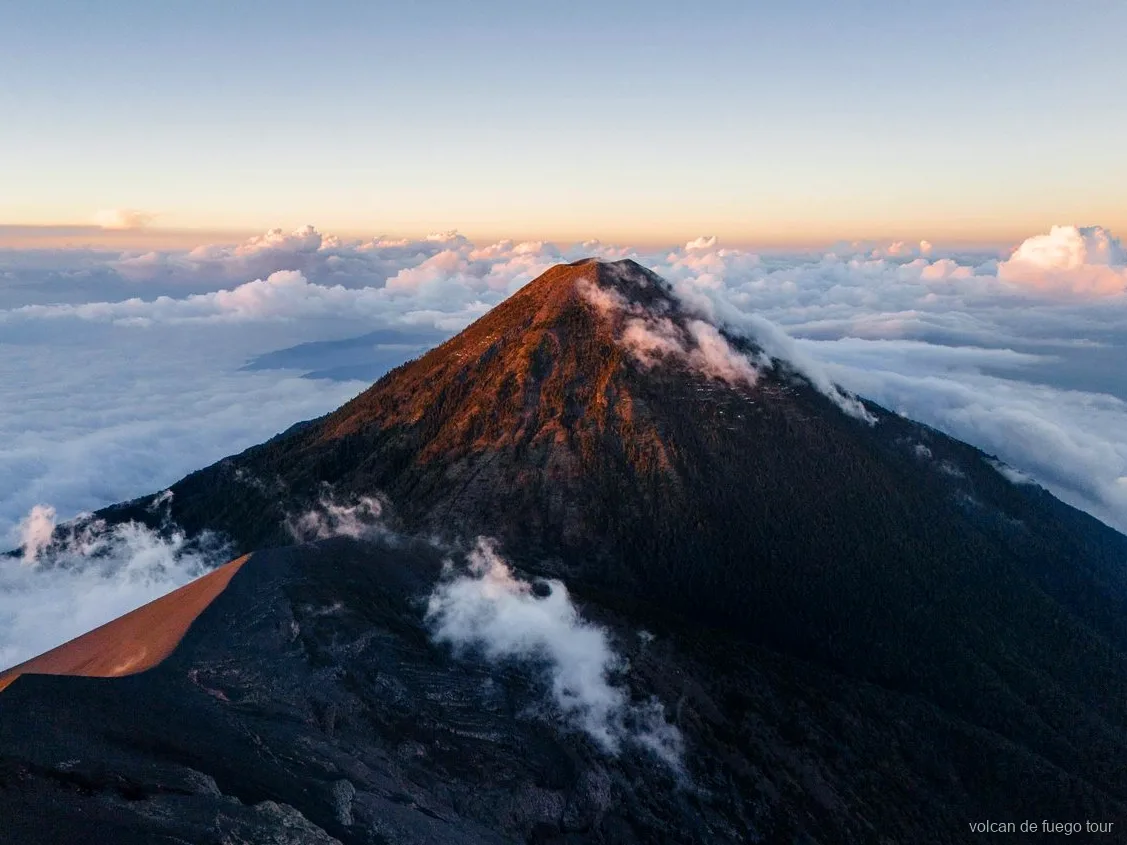 Sunrise view from the Acatenango summit on the Fuego volcano glamping tour